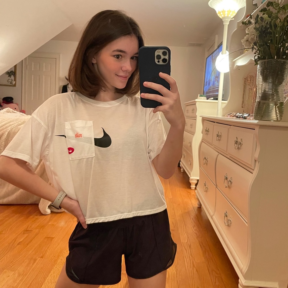 Nike, cropped flowy workout top.